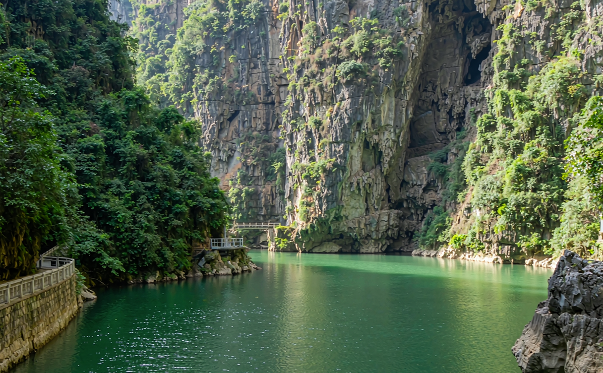 The Tongling karst canyon with towering cliffs and an emerald river in Baise, Guangxi, China