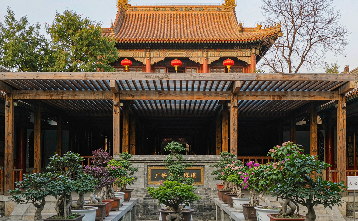 Peaceful courtyard with ancient trees and stone lanterns inside Fayuan Temple Beijing
