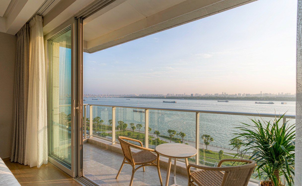 Hotel room balcony facing the Yangtze River in Nanjing at dusk