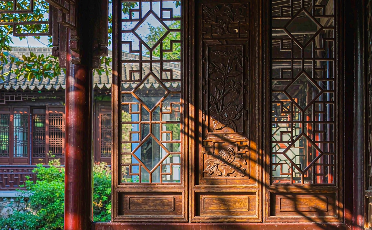 Lattice window framing a rockery in a Suzhou garden