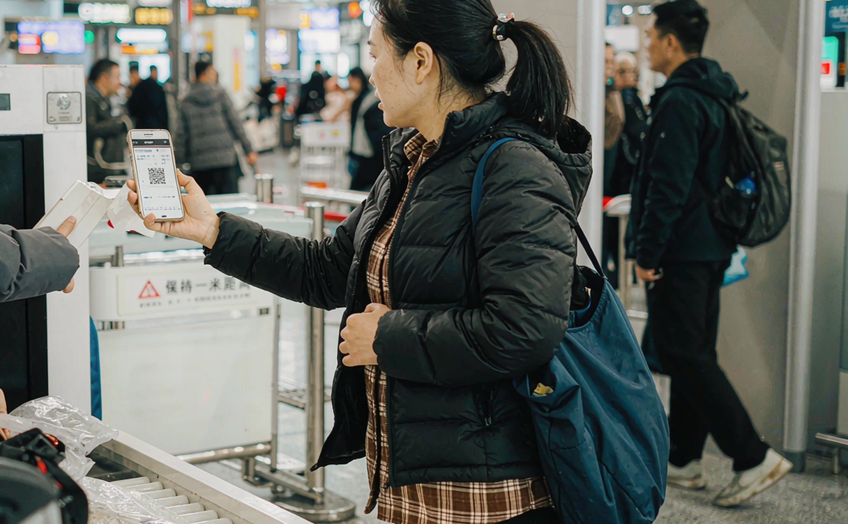 Checking a domestic flight booking on phone at China airport