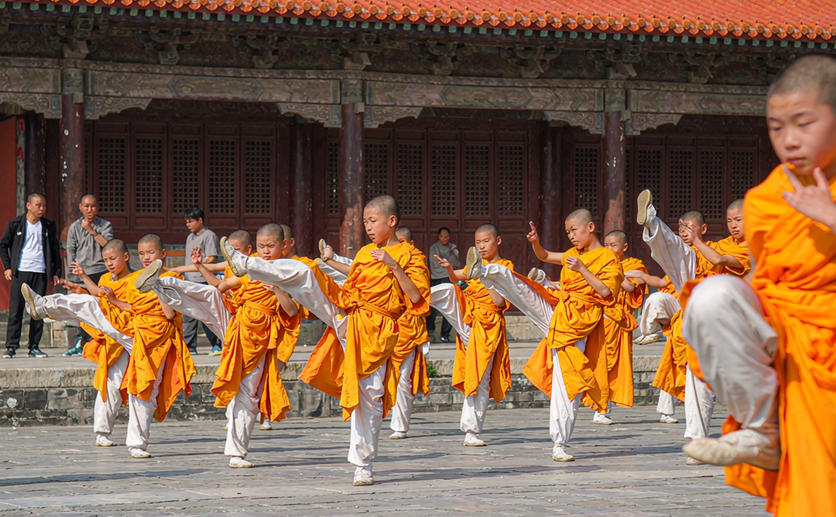 Kung fu students training in a Shaolin academy courtyard