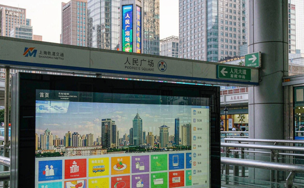 Traveler getting help at China railway station service desk