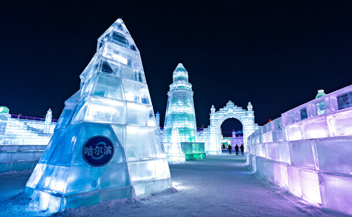 Towering colorful ice sculptures lit at night during a China ice festival