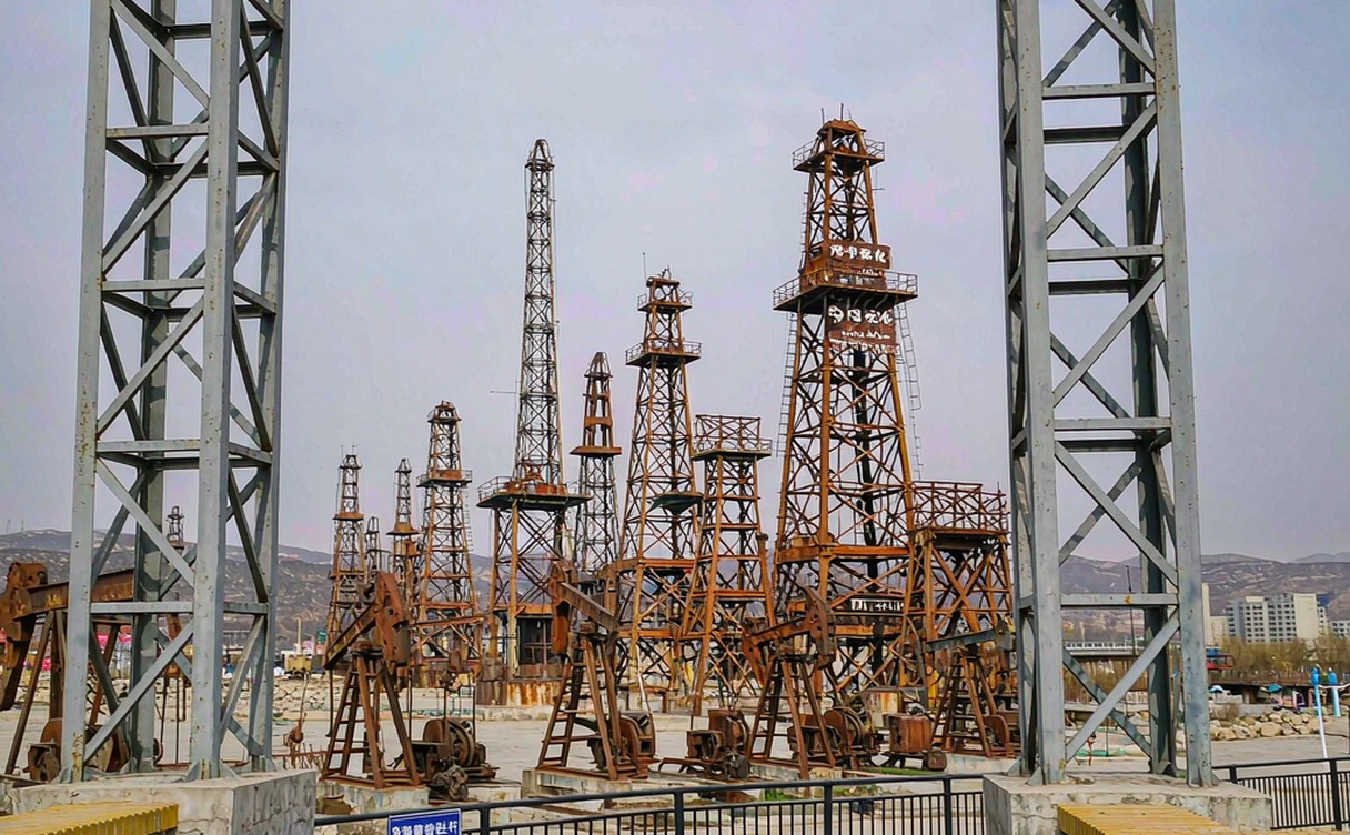 Daqing oil pumping units in snow on a winter plain