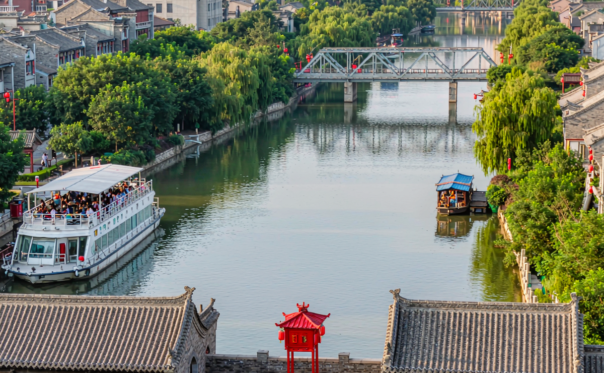 The old Grand Canal embankment and stone bridges at dusk in Dezhou, Shandong, China