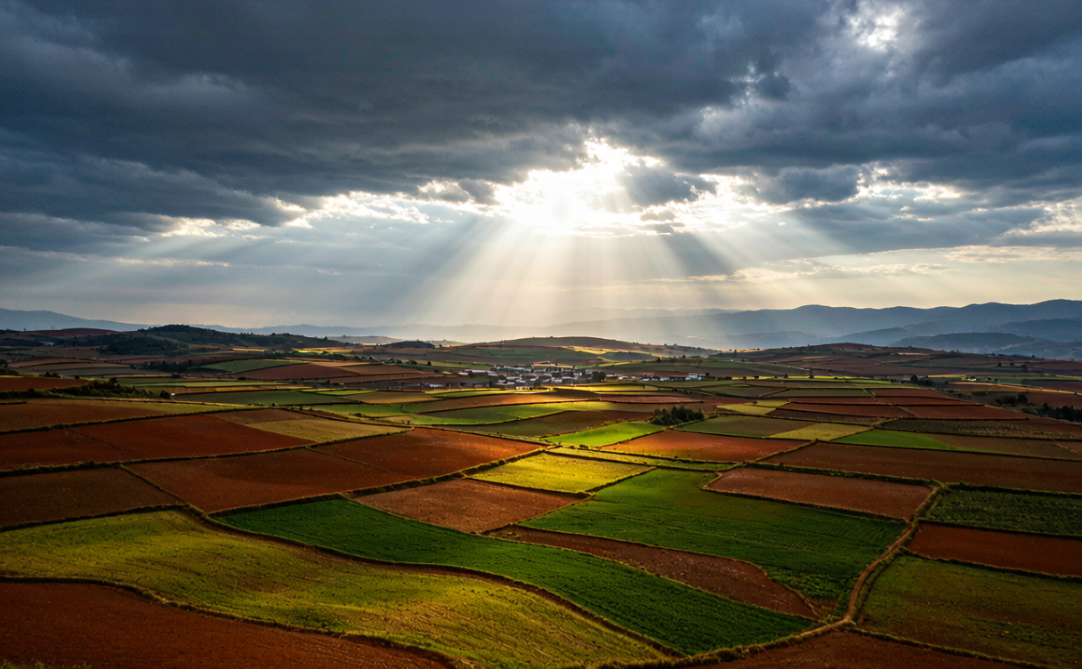 Farmhouse among red earth terraces in Dongchuan, Yunnan, China after rain