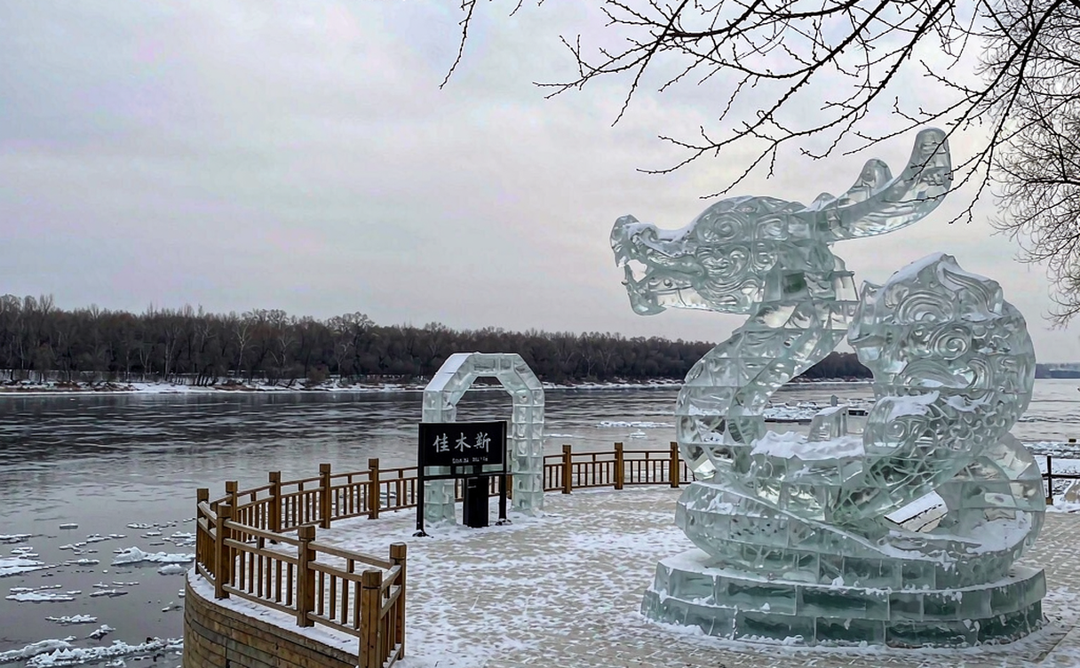 People ice fishing on the frozen Songhua River in Jiamusi at dusk