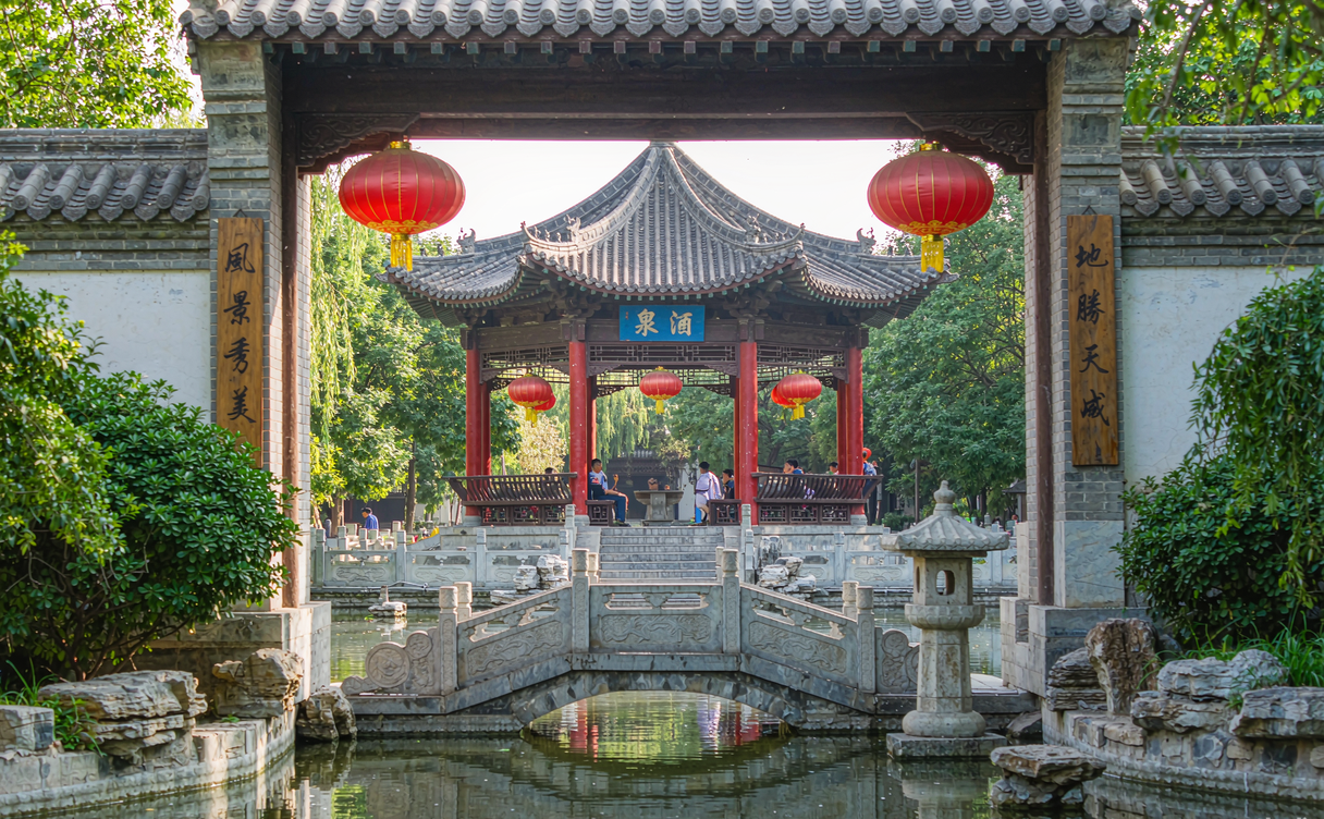 historic Jiuquan wine spring pavilion in a walled garden