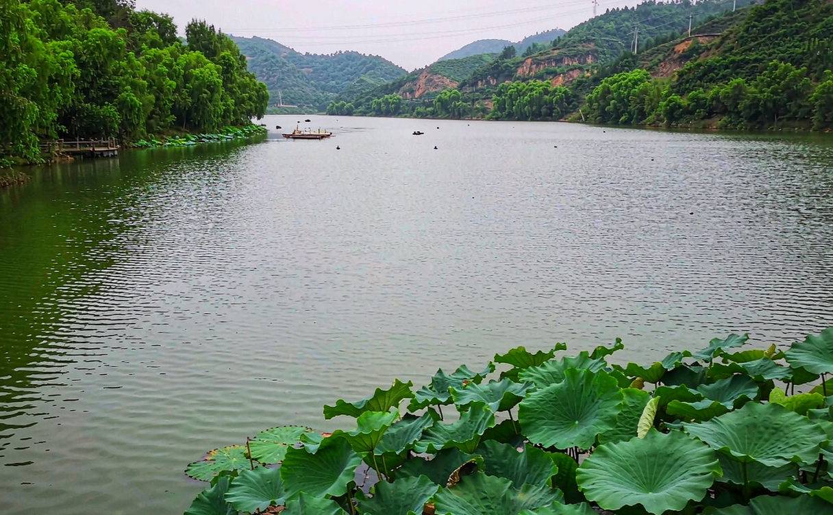 Retired coal mine train and headframes at Jixi Coal Mining Heritage Park