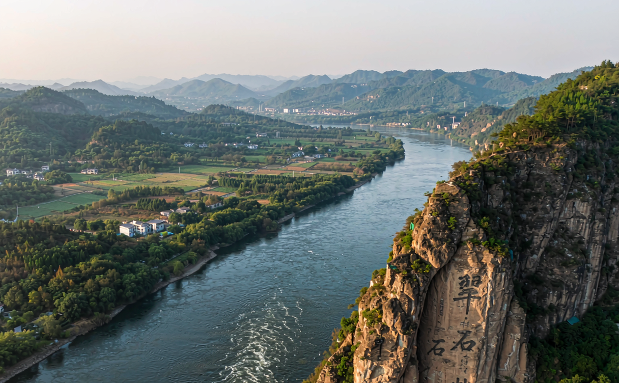 Caishi Cliff pavilion overlooking the wide Yangtze River at golden hour in Ma'anshan, Anhui, China