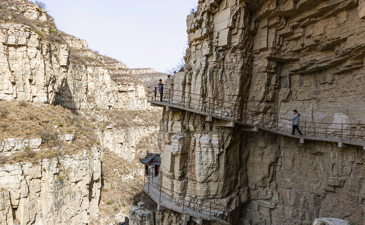Mianshan suspended walkways along a cliff face in Shanxi, China at daylight