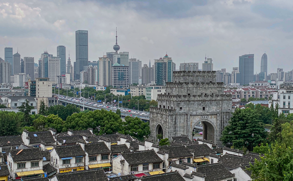Tourists strolling the top of Nanjing city wall at Zhonghua Gate overlooking the old town