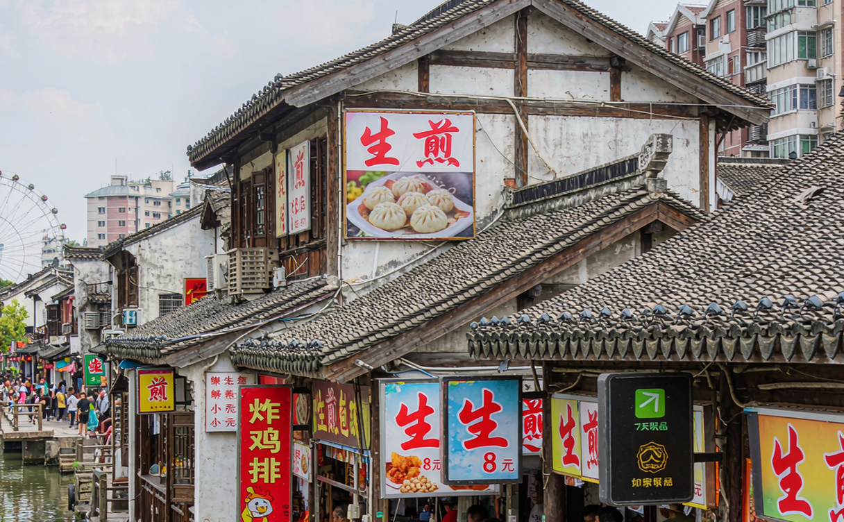 Qibao old town canal with stone bridge and red lanterns near Shanghai