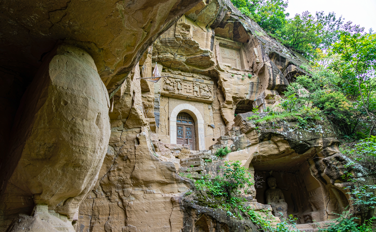 Yellow terraced loess hills with whitewashed cave houses in Qingyang