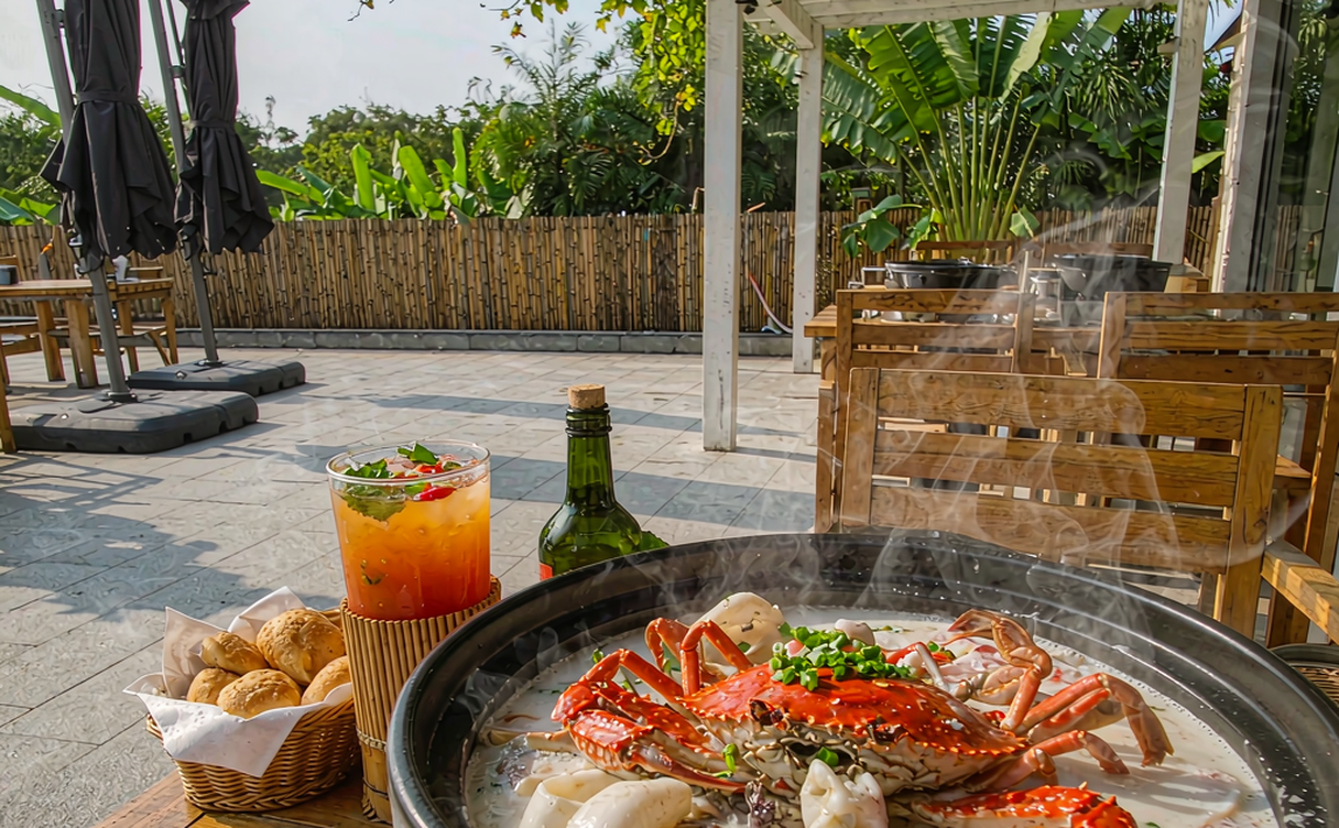 Grilled seafood platter on a beachfront table at a Sanya restaurant at sunset