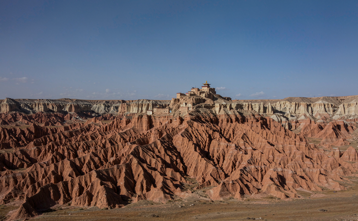 Sunset light striking eroded clay arches of the Zanda Earth Forest in Tibet, China