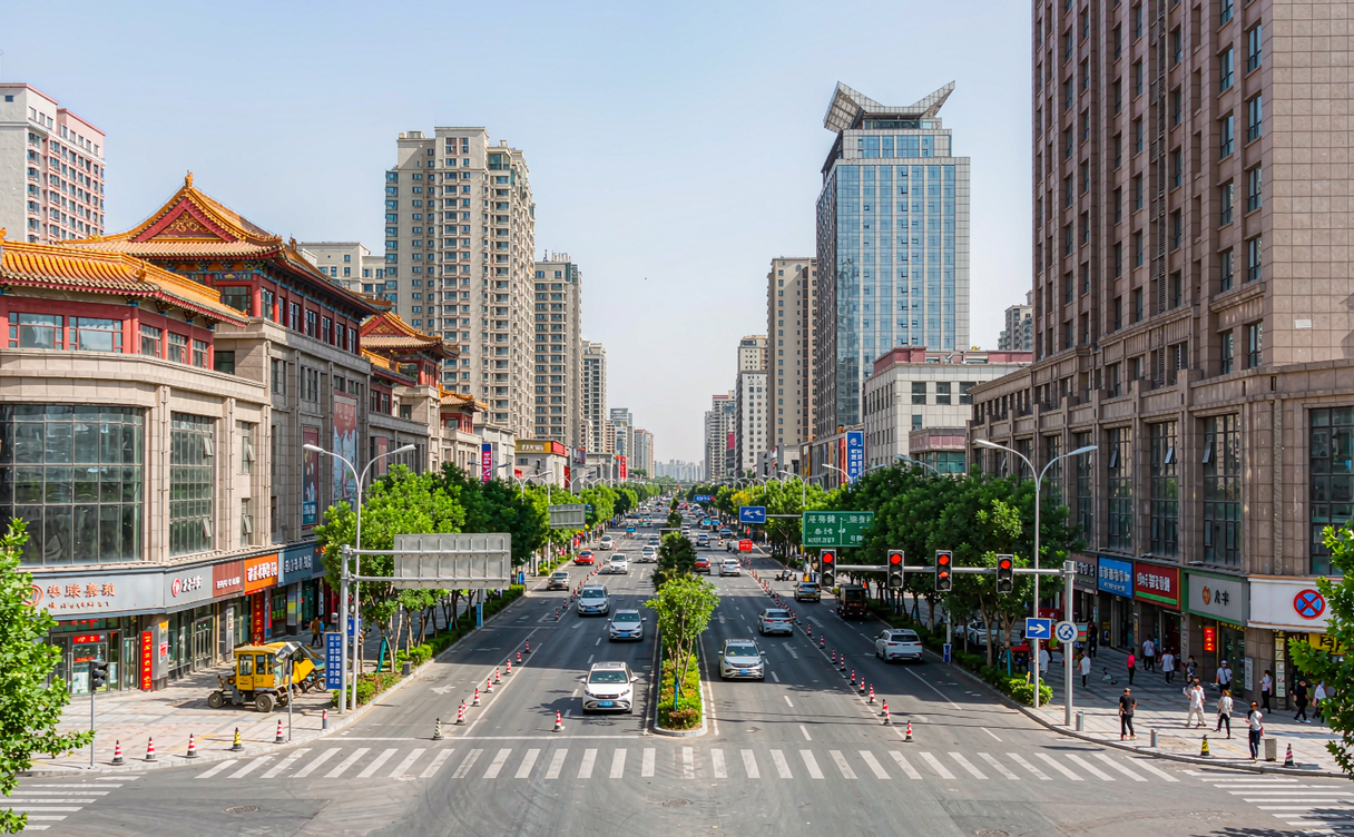Taiyuan Fen River promenade at dusk with lit hotel towers