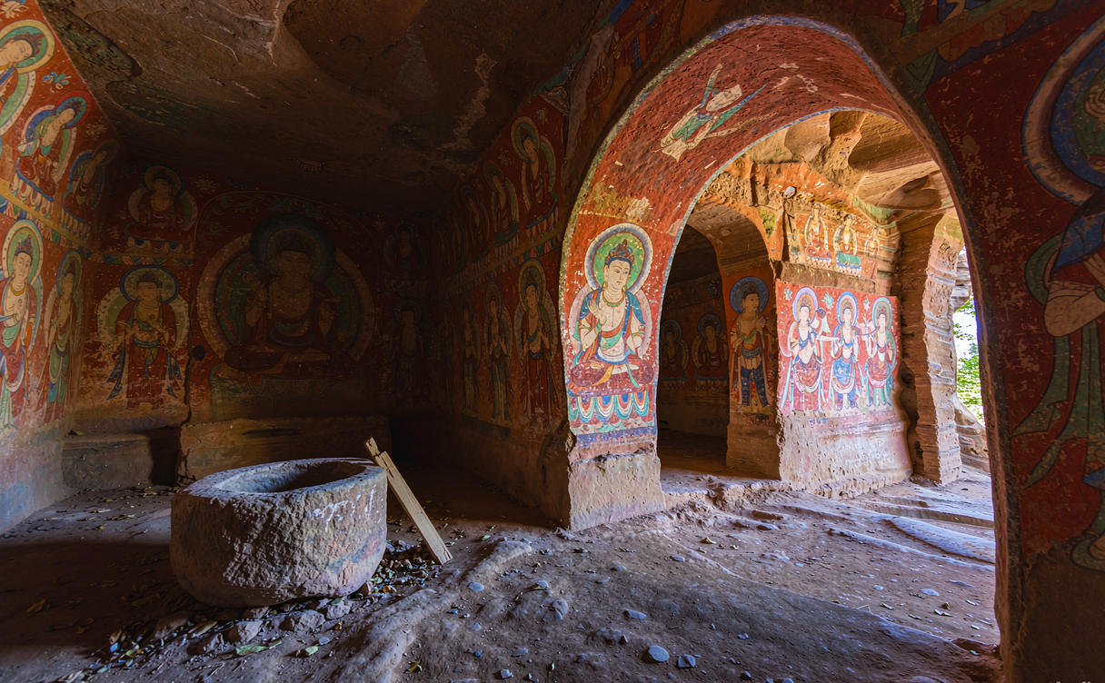 Colorful surviving murals on the wall of a Bezeklik cave