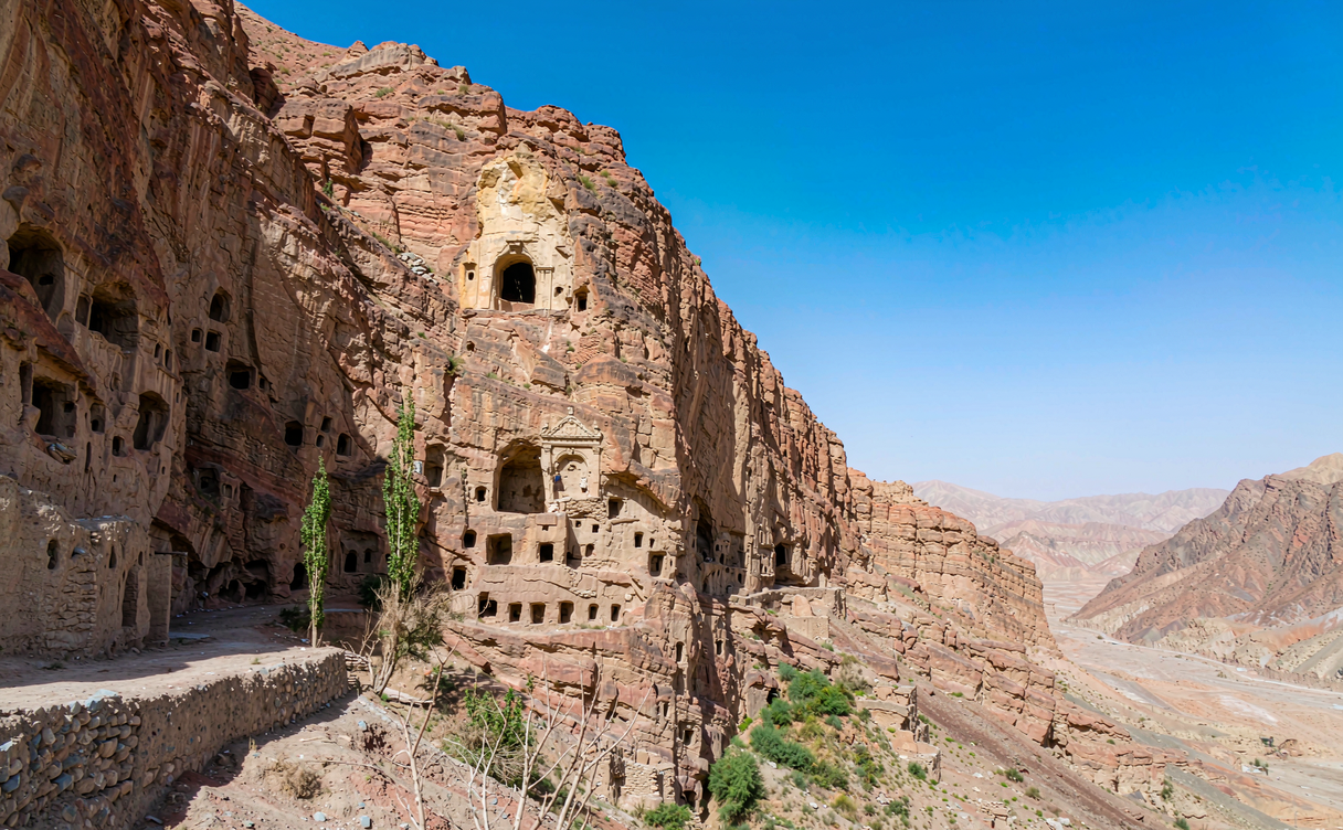 Cliff carved with grotto openings at Bezeklik cave complex