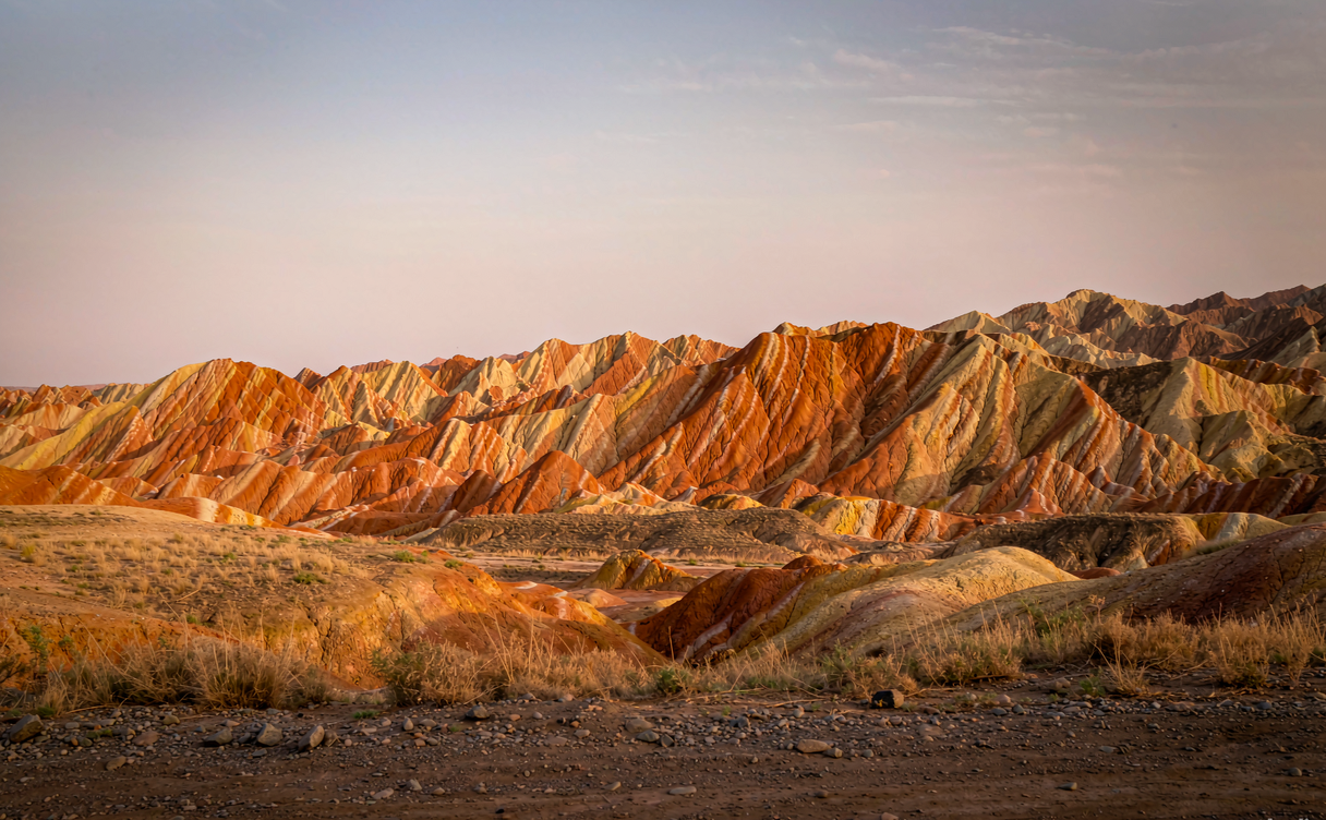 Castle-like red and cream danxia rock towers at Binggou Danxia, Zhangye, Gansu, China