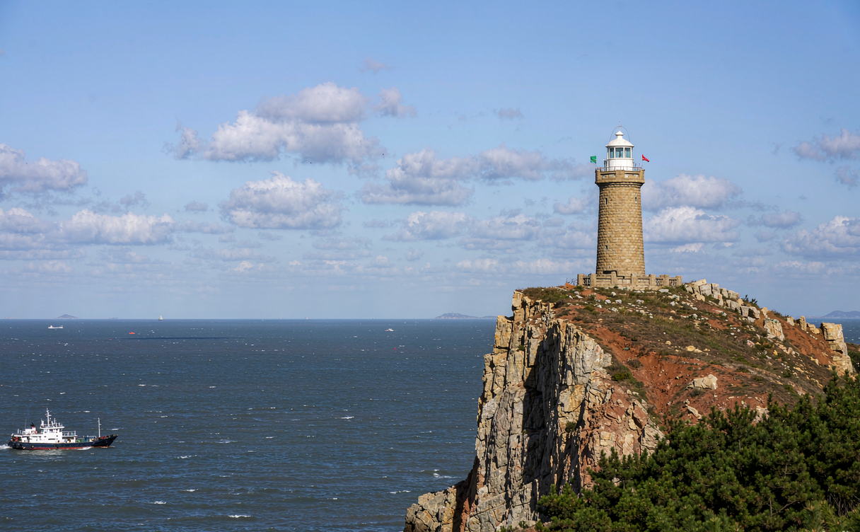 Stone lighthouse on a cliff above the Bohai Sea at Changdao