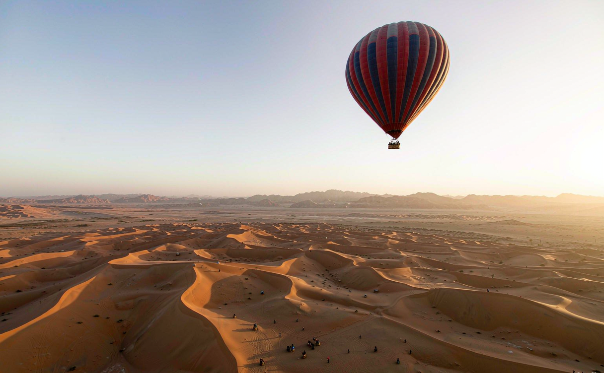 Hot air balloons at sunrise over Zhangye Danxia landforms in Gansu, China