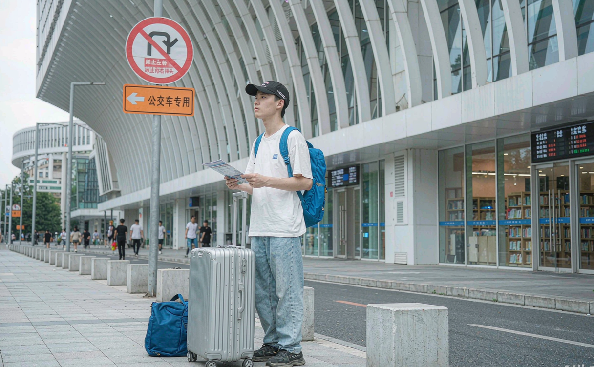 Traveler with a roll-on suitcase exploring a Chinese city during a layover
