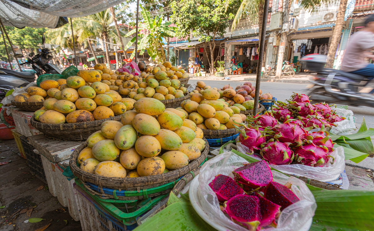 Night market fruit stall with mangosteen and rambutan in Xishuangbanna