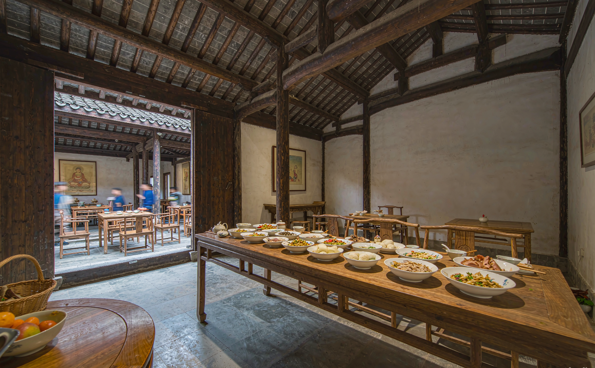 Monk preparing vegetarian food in a Chinese temple kitchen