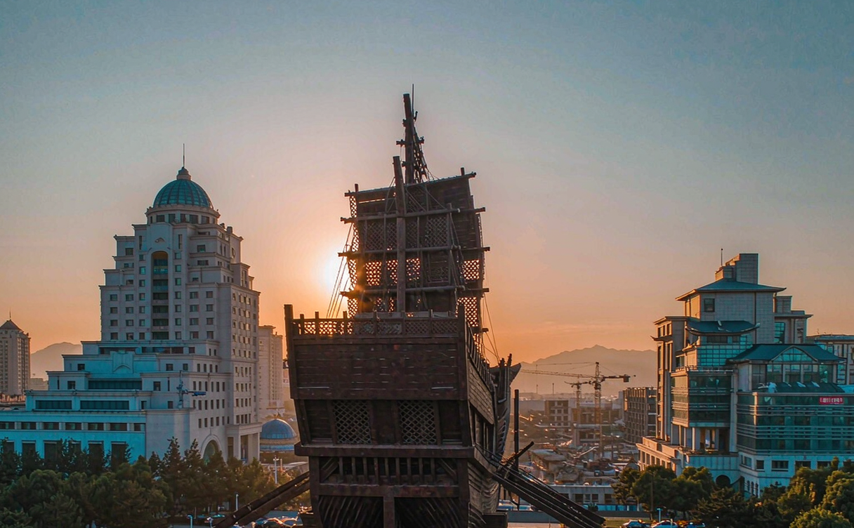 Dalian Xinghai Square seafront promenade and public art at dusk