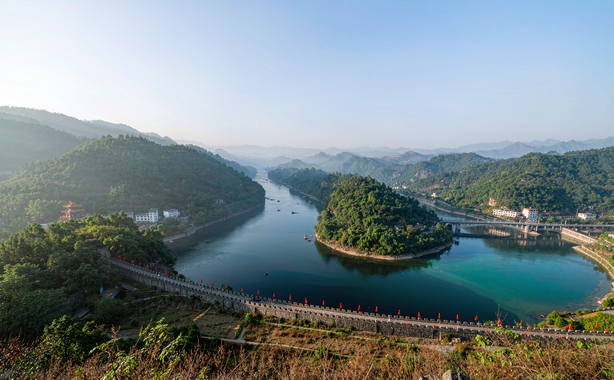 Reconstructed watchtower at Diaoyucheng fortress overlooking the misty Jialing River valley