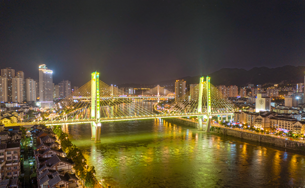 Duyun bridge city skyline with illuminated cable bridges over the Jianjiang River, Guizhou