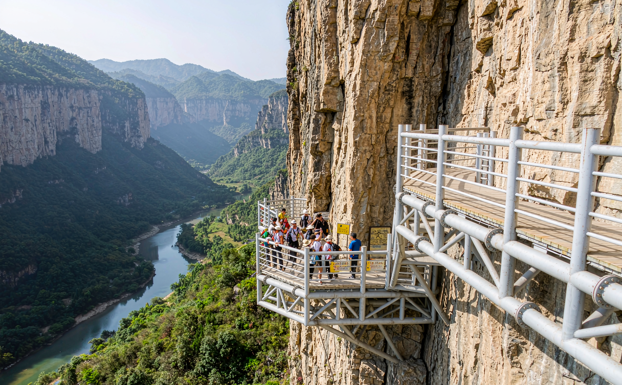 Slender Yizhuxiang stone pillar rising from the misty Enshi Grand Canyon karst valley in Hubei, China