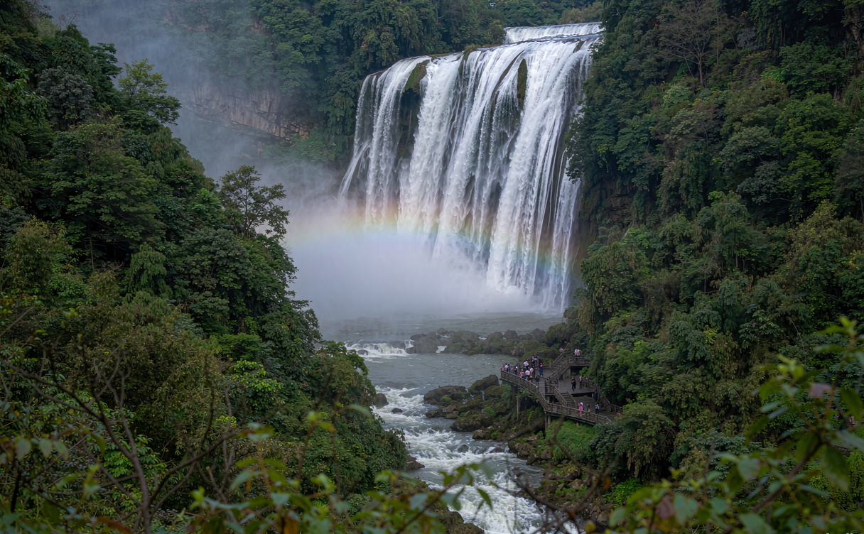 Wide Huangguoshu Waterfall plunging into the pool with mist