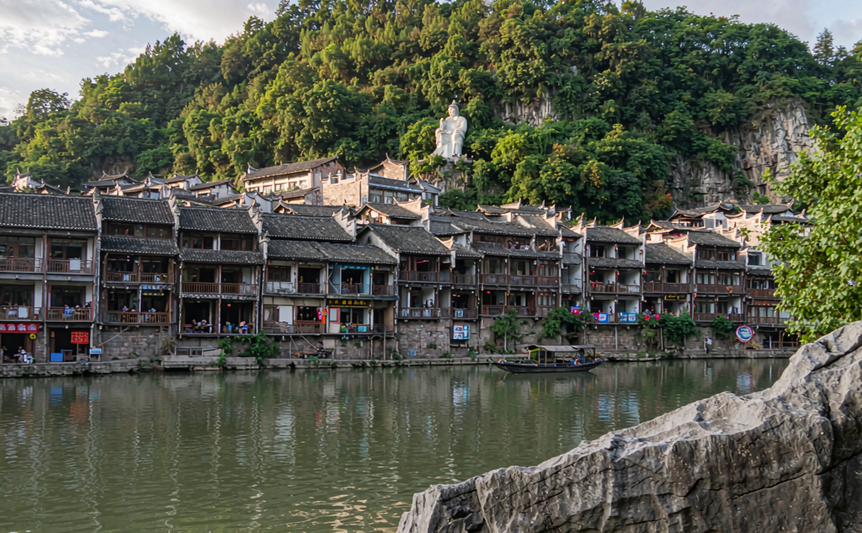 Huili ancient town grey-brick lane lit by lanterns at dusk