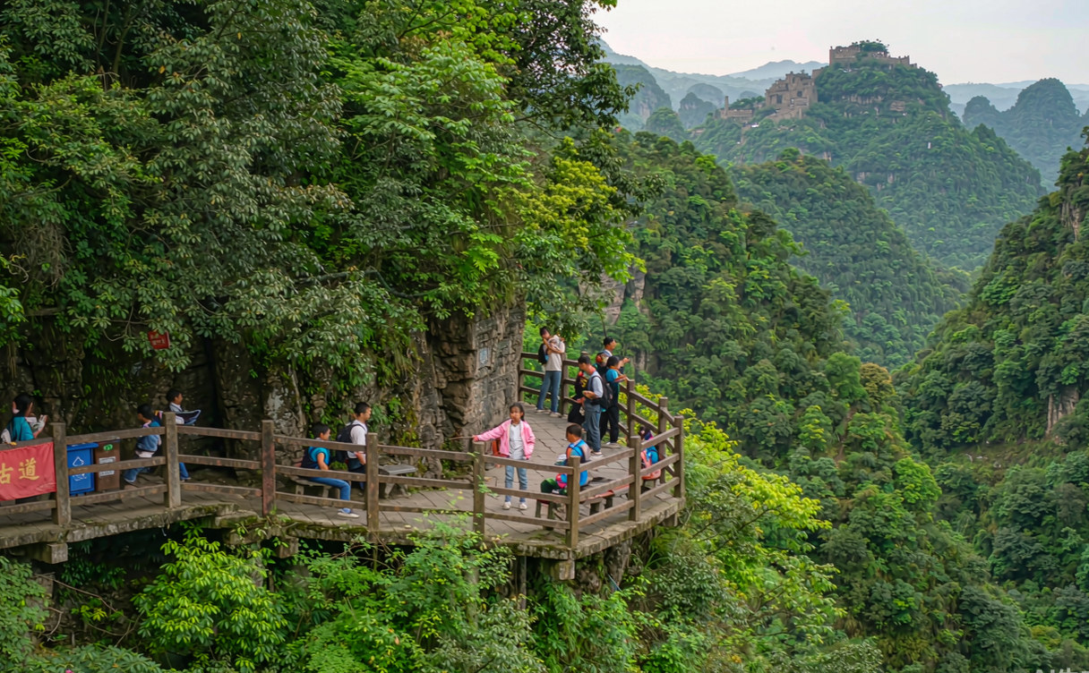 Hikers on the Shu Road plank walk near Jianmen Sichuan China