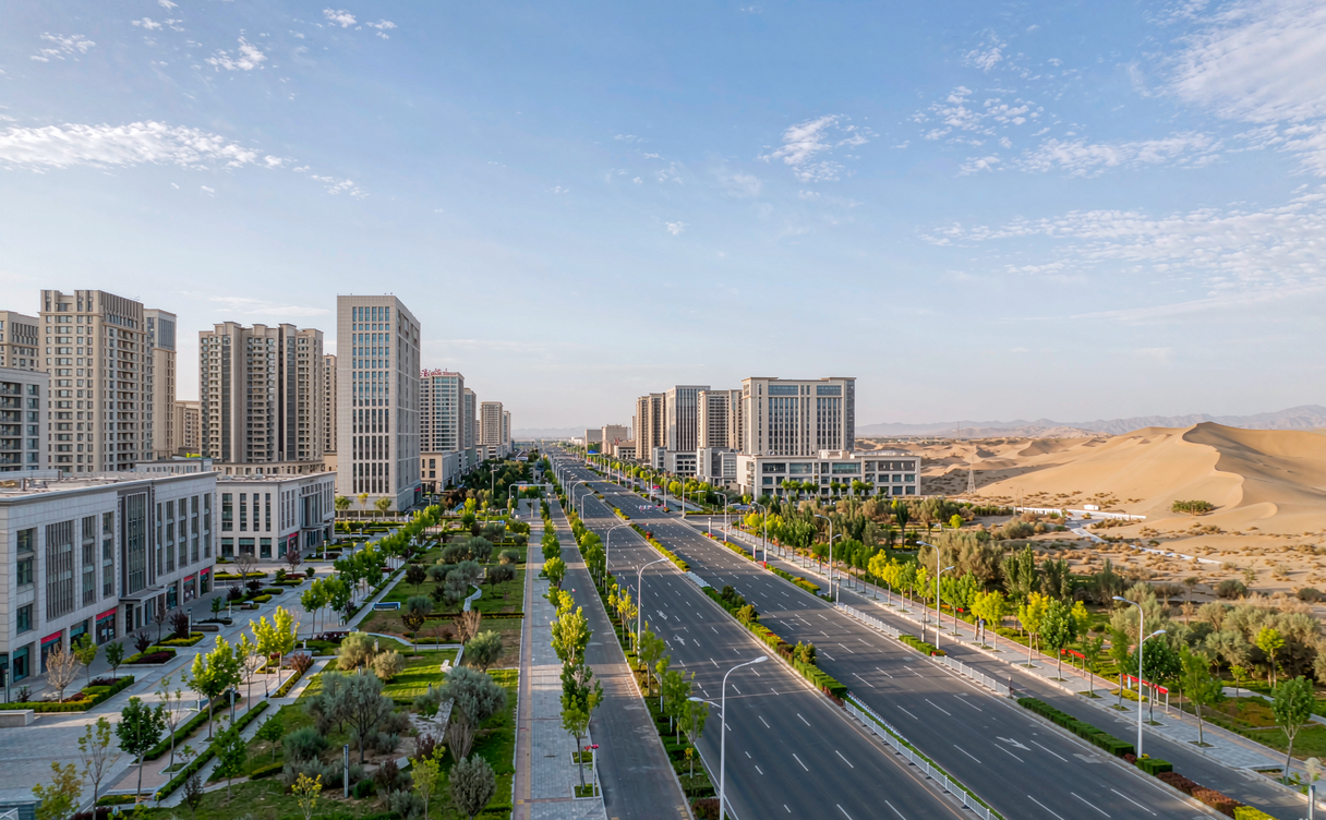 Kuitun cityscape with Tianshan mountains in the distance, Xinjiang, China
