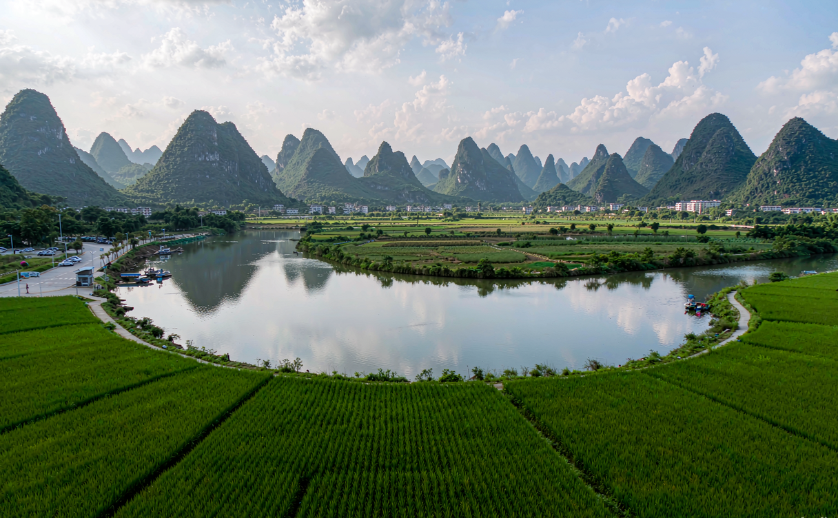 A bamboo raft floating down the green Yulong River near Yangshuo, Guangxi