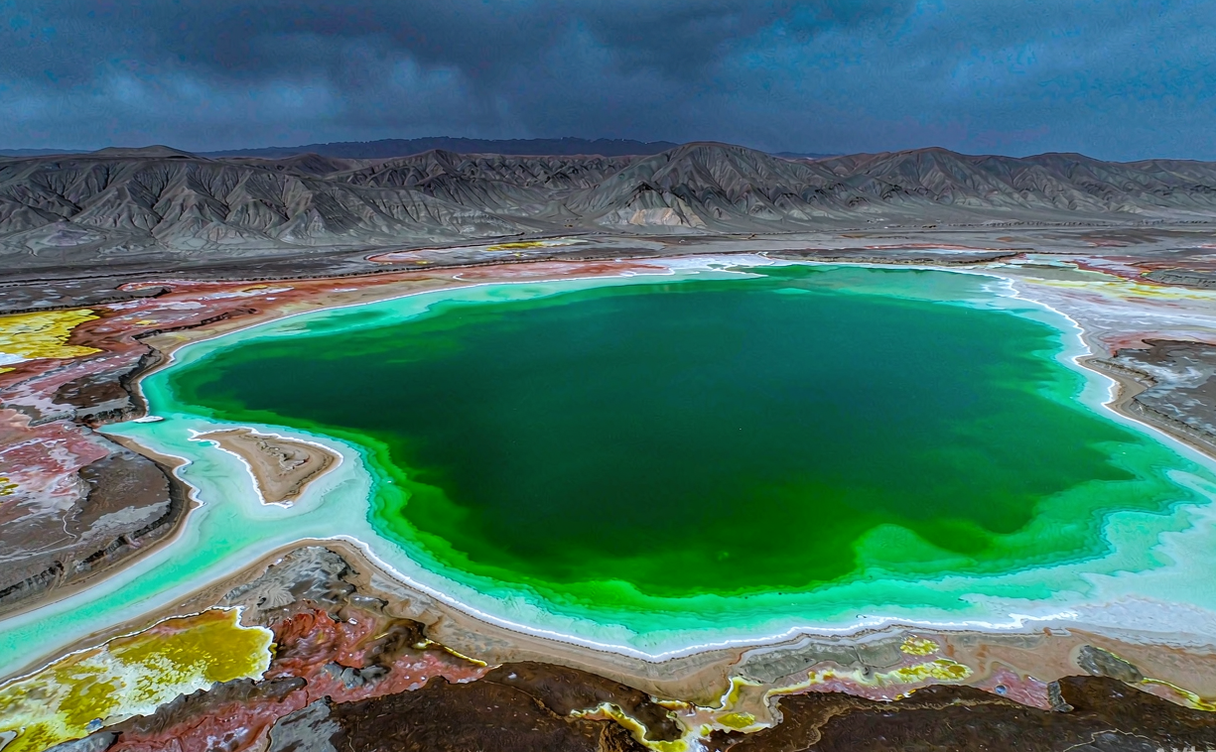 Aerial view of turquoise Emerald Lake and the red Aiken Spring in Mangnai, Qinghai, China