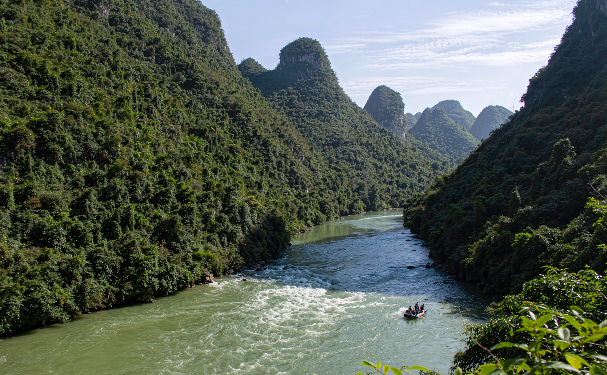 Rubber raft drifting through Mengdong River gorges in Hunan China