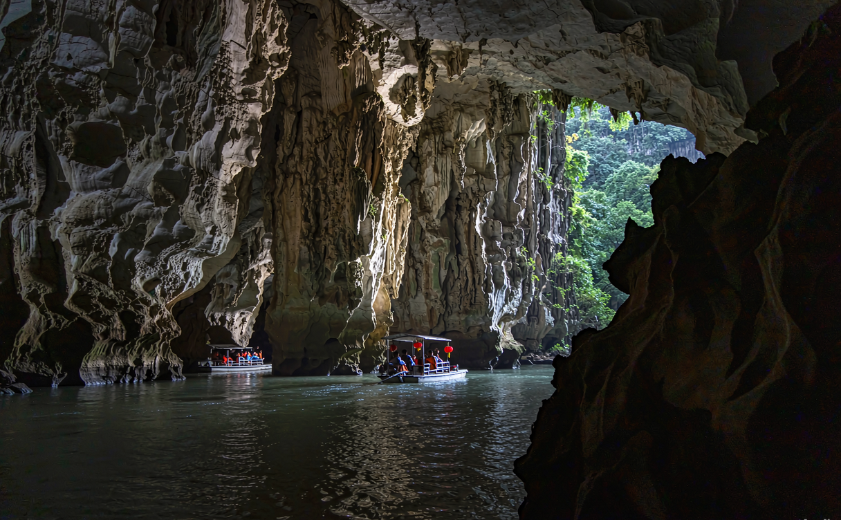 Floodlit limestone cave boat tour on the Mengdong River Hunan