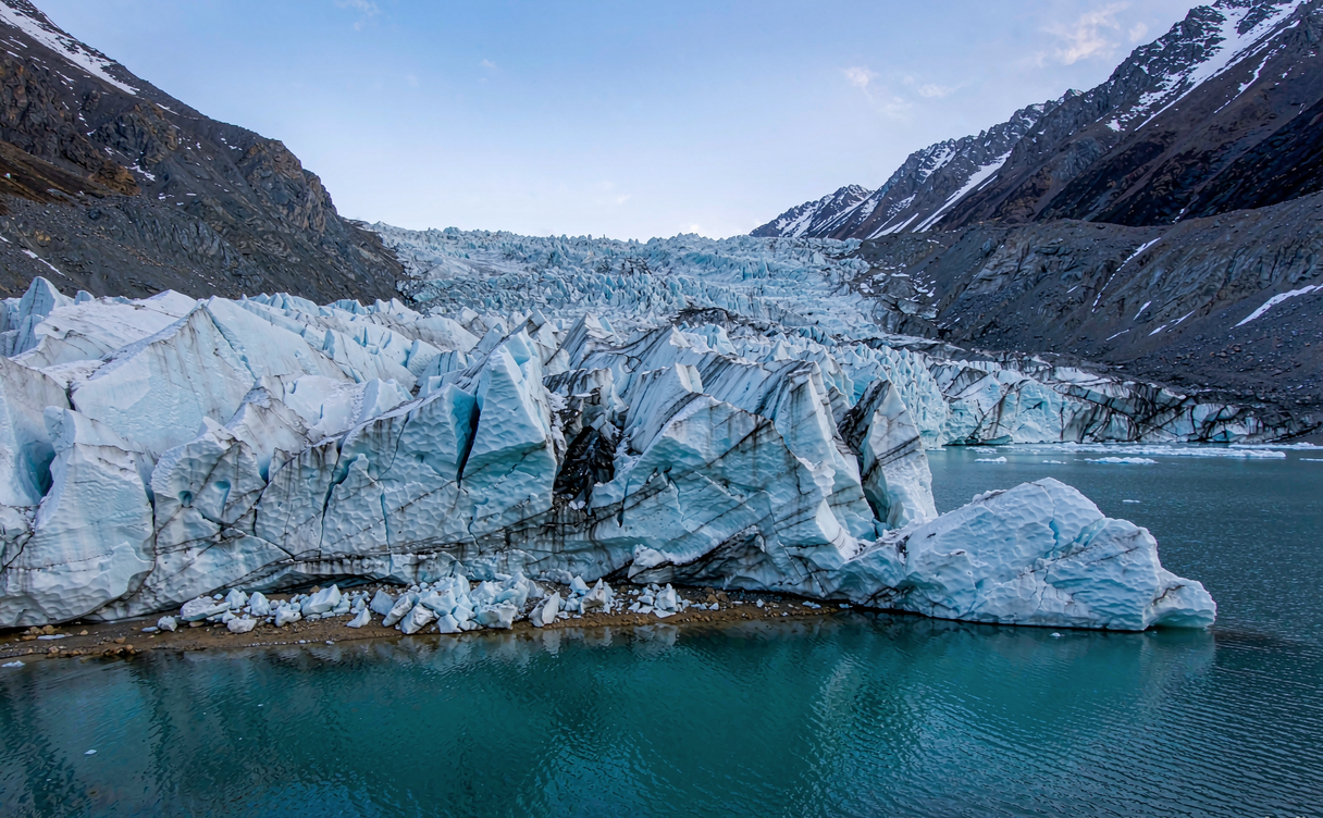 Midui Glacier icefall flowing down into a forested valley near Nyingchi Tibet China