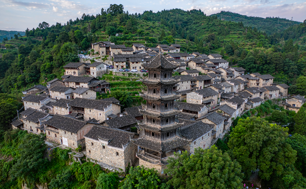 Stone houses and old pagoda in Nuodeng Bai village Yunnan