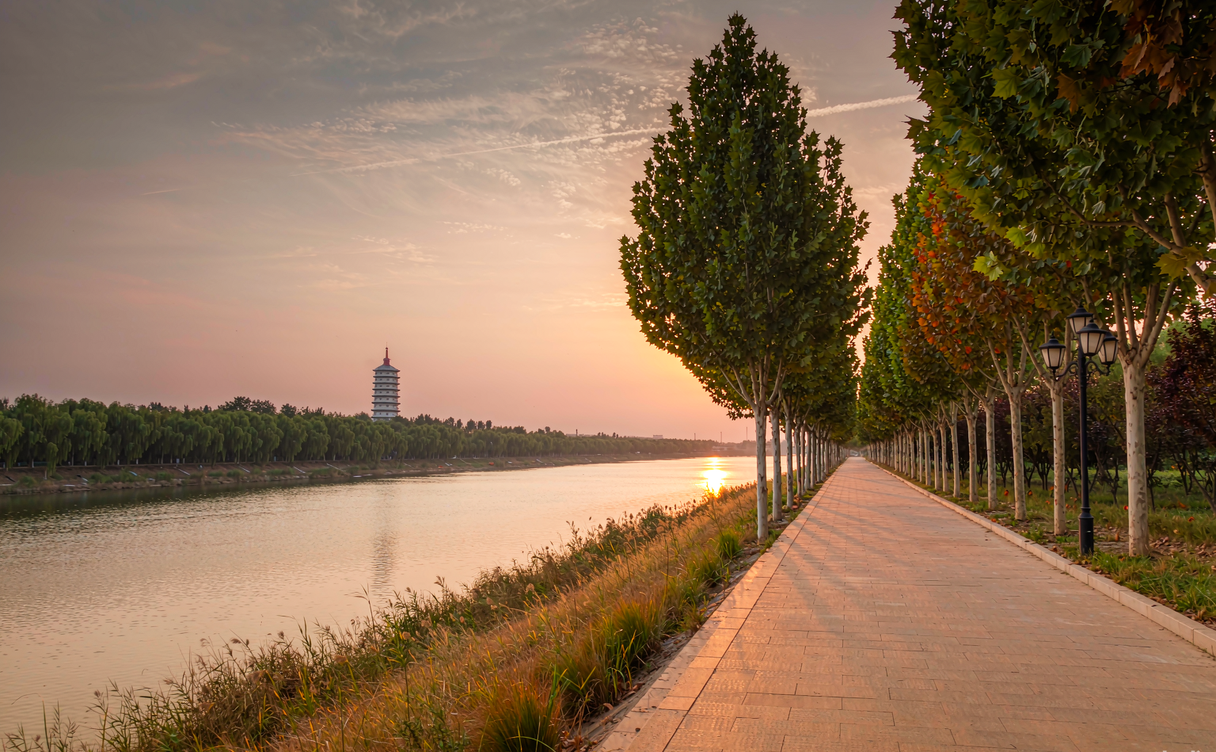 Puyang Yellow River levee walk cycling path along the old river course at sunset