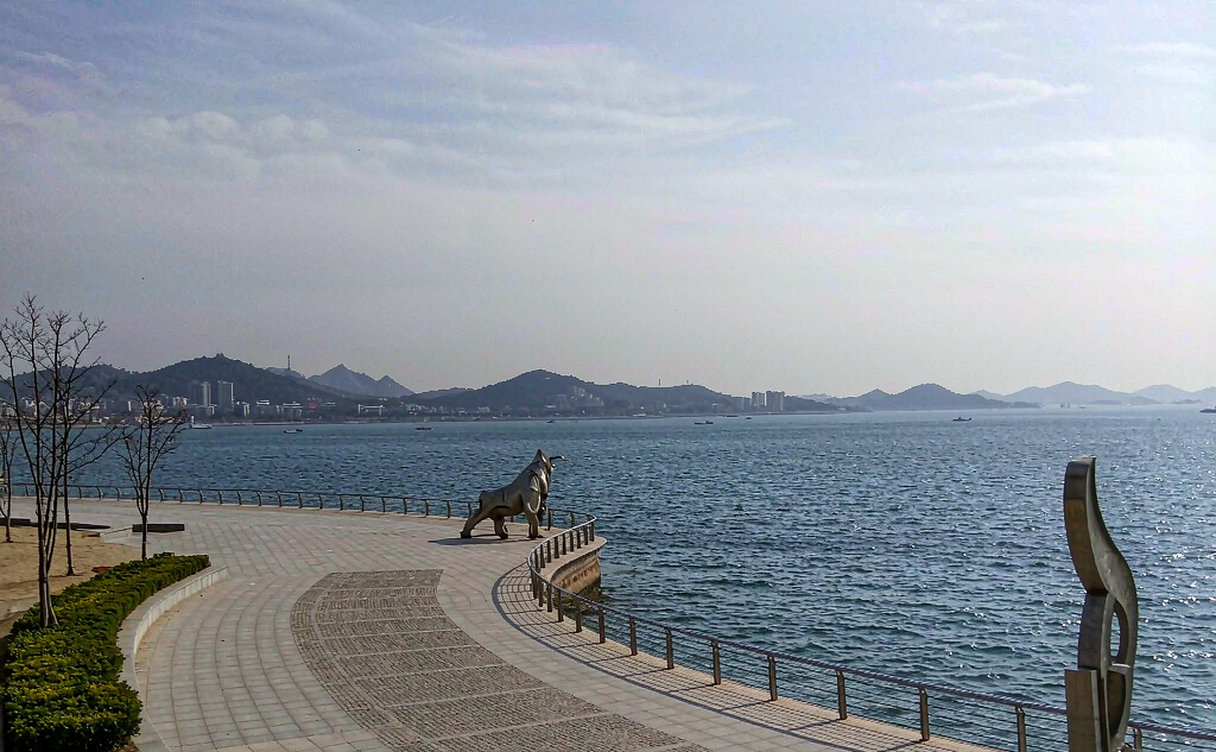 Qingdao May Fourth Square red Wind of May sculpture lit at night