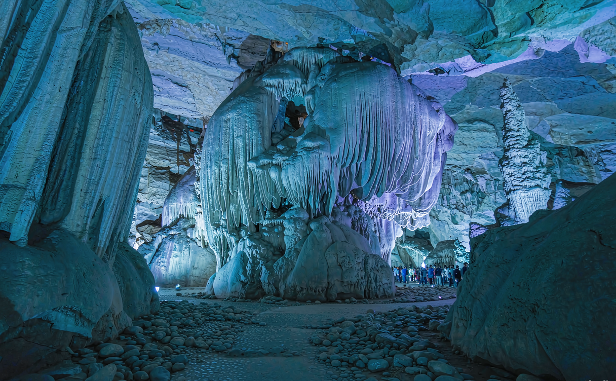 Reed Flute Cave main chamber lit in colored lights