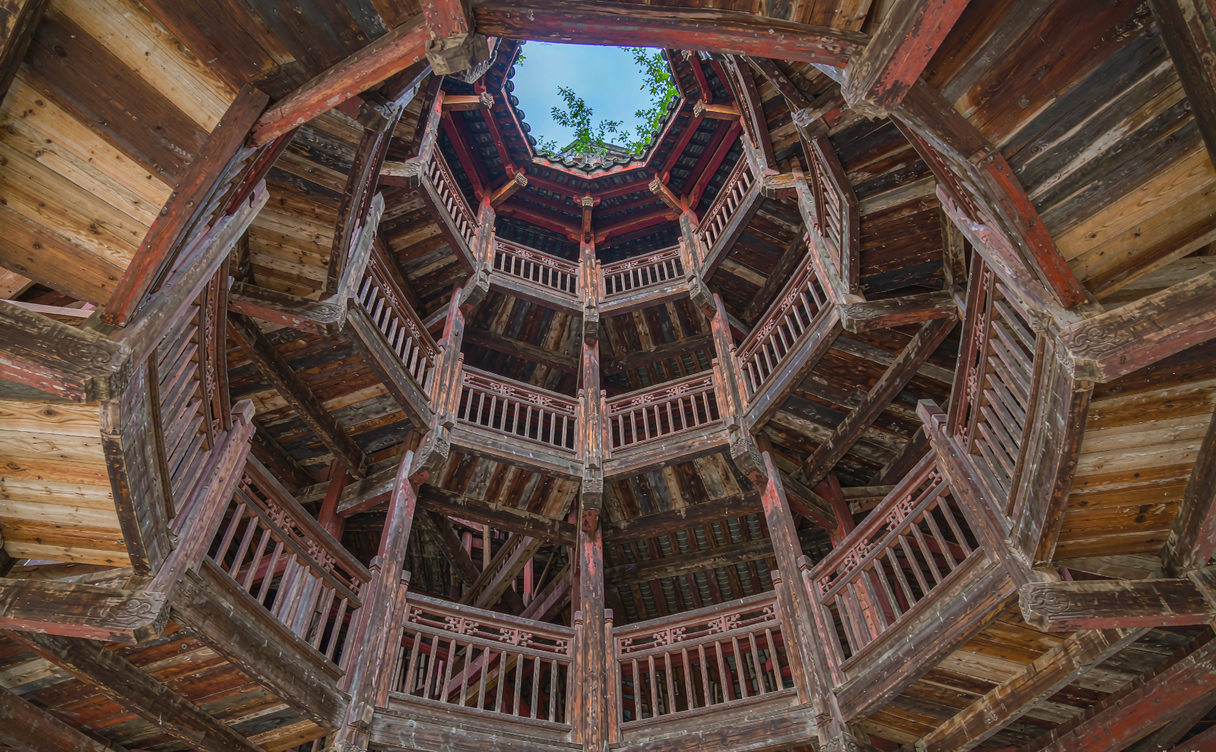 Red wooden Shibaozhai tower built against a sheer cliff above the Yangtze River