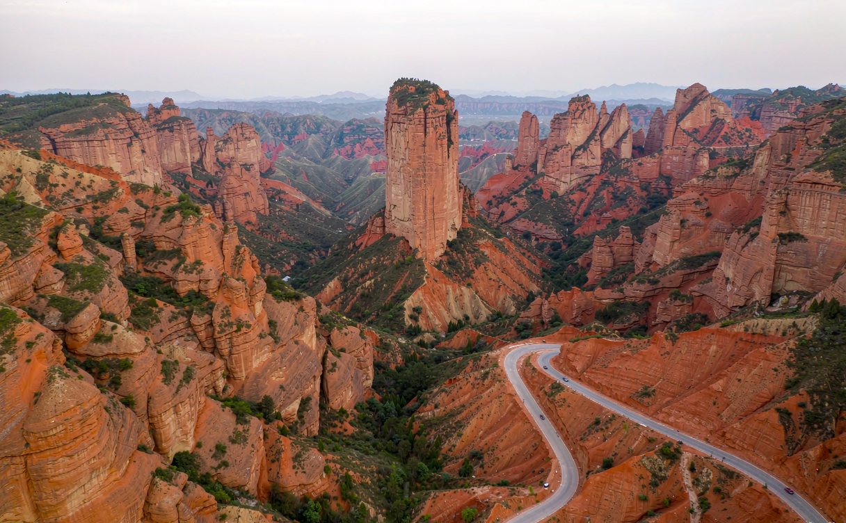Red Danxia cliffs and a glass walkway edge at Shiniuzhai Hunan