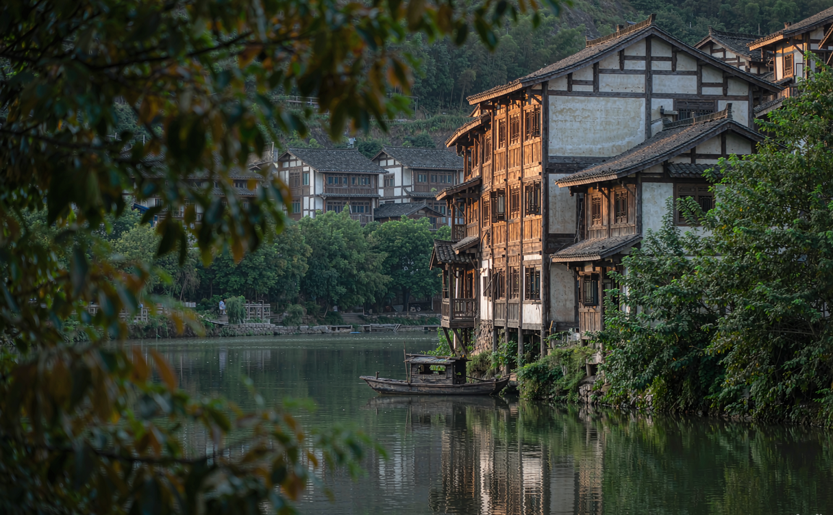 A stone-paved ancient Huizhou trade road climbing through terraced fields on Xianyu Mountain in Shitai, China
